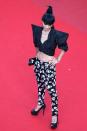 Actress Bai Ling seems to have dressed for the wrong event, with a look totally unsuitable for a prestigious Film Festival. While the eighties-style top is a great start, the skull pants and platforms kill the look. Cannes, May 21, 2013