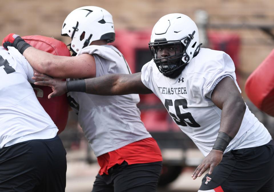 Texas Tech's Dennis Wilburn does a drill during football practice, Thursday, March 23, 2023, at Sports Performance Center.
