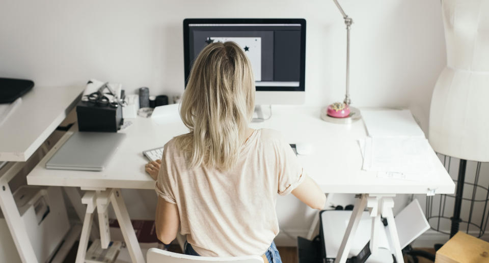 High angle view of female design professional using computer at home. Source: Getty Images