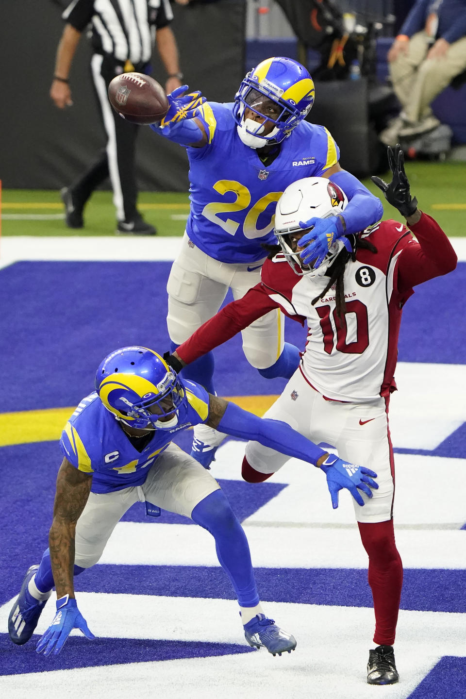 Los Angeles Rams cornerback Jalen Ramsey (20) and free safety John Johnson III, bottom, defend a pass intended for Arizona Cardinals wide receiver DeAndre Hopkins (10) during the second half of an NFL football game in Inglewood, Calif., Sunday, Jan. 3, 2021. (AP Photo/Jae C. Hong)