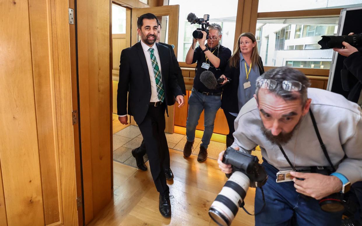 Humza Yousaf leaves an SNP group meeting at the Scottish Parliament building on Tuesday, a day after he announced his resignation