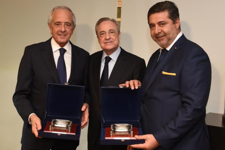 Rodolfo D'Onofrio y Daniel Angelici con Florentino Pérez, en una reunión efectuada en noviembre de 2019