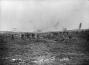 <p>Canadian soldiers on the left advance on Vimy Ridge while German soldiers on the right come out of their dugouts to surrender in April 1917. Photo from Library and Archives Canada. </p>