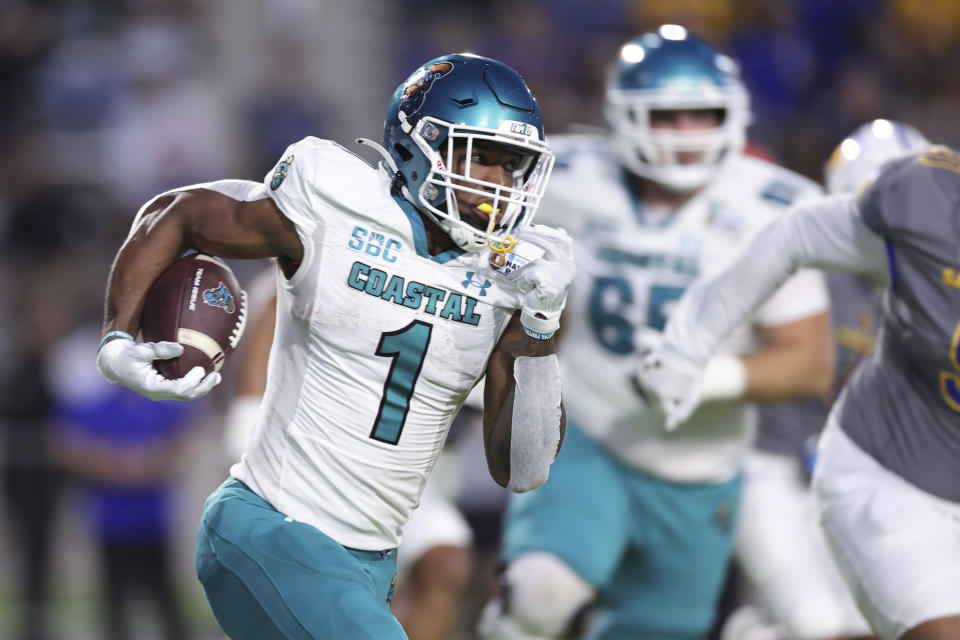 Coastal Carolina running back Braydon Bennett (1) carries against San Jose State during the first half of the Hawaii Bowl NCAA college football game, Saturday, Dec. 23, 2023, in Honolulu. (AP Photo/Marco Garcia)