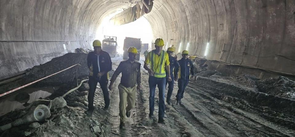 This photo provided by Uttarakhand State Disaster Response Force (SDRF) shows rescuers and others inside a collapsed road tunnel where 40 workers were trapped in northern in Uttarakhand state, India, Tuesday, Nov.14, 2023. ( SDRF via AP)