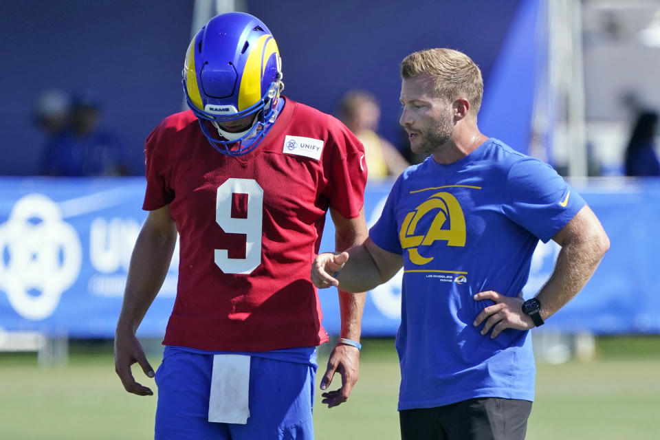 Los Angeles Rams coach Sean McVay talks to quarterback Matthew Stafford during practice at the NFL football team's training camp Wednesday, July 28, 2021, in Irvine, Calif. (AP Photo/Marcio Jose Sanchez)