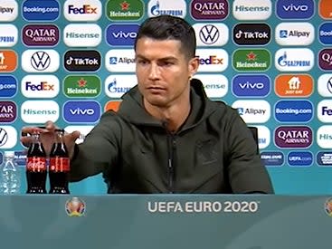 Cristiano Ronaldo removed bottles of Coca-Cola from sight during his press conference (YouTube/ BeanymanSports)