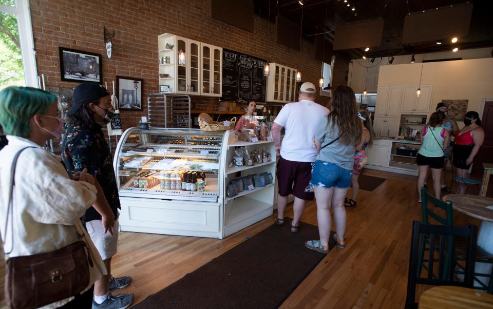 Customers line up to order in Little Bird Bakeshop in Old Town Fort Collins in 2021.