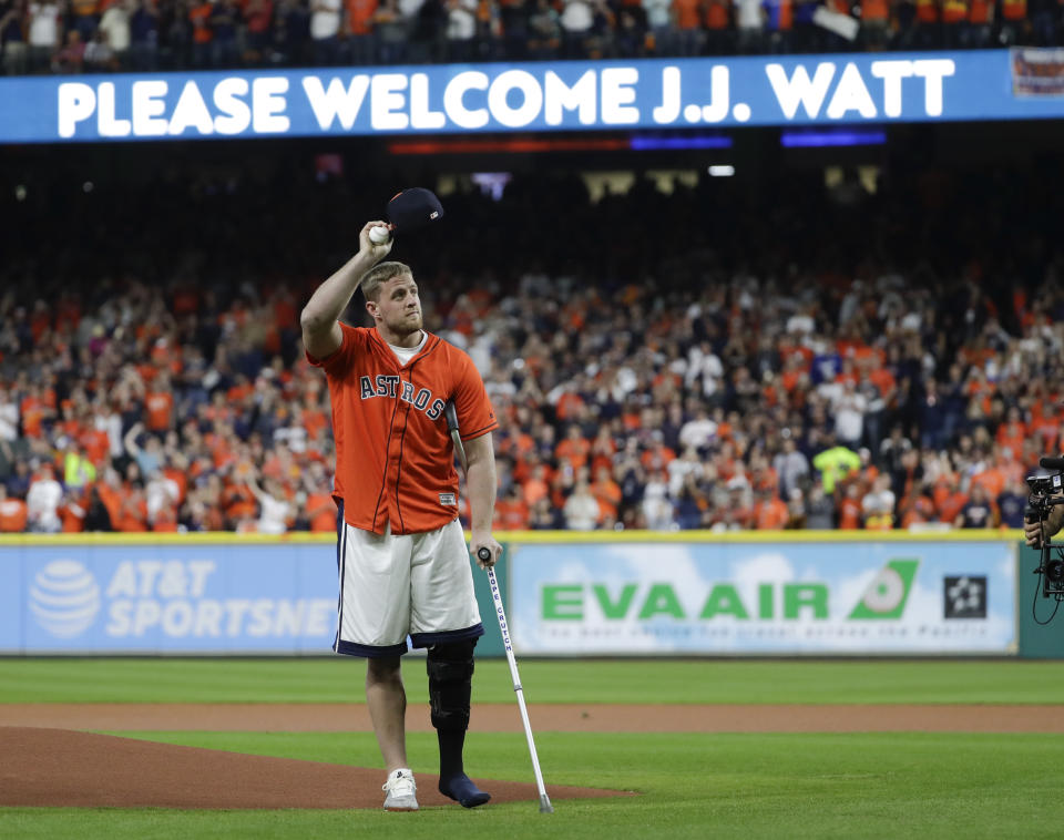Houston Texans’ J.J. Watt prepares to throw out the first pitch before Game 3 of baseball’s World Series between the Los Angeles Dodgers and the Houston Astros Friday, Oct. 27, 2017, in Houston. (AP Photo/Matt Slocum)