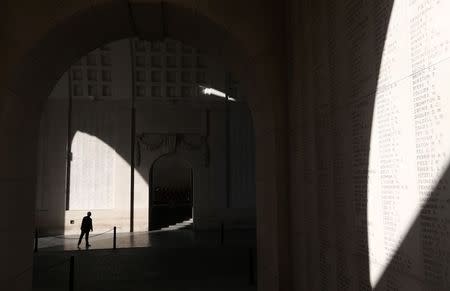 A man looks at engraved names of Commonwealth soldiers who died in World War One at the Menin Gate Memorial in Ypres October 20, 2014. REUTERS/Francois Lenoir