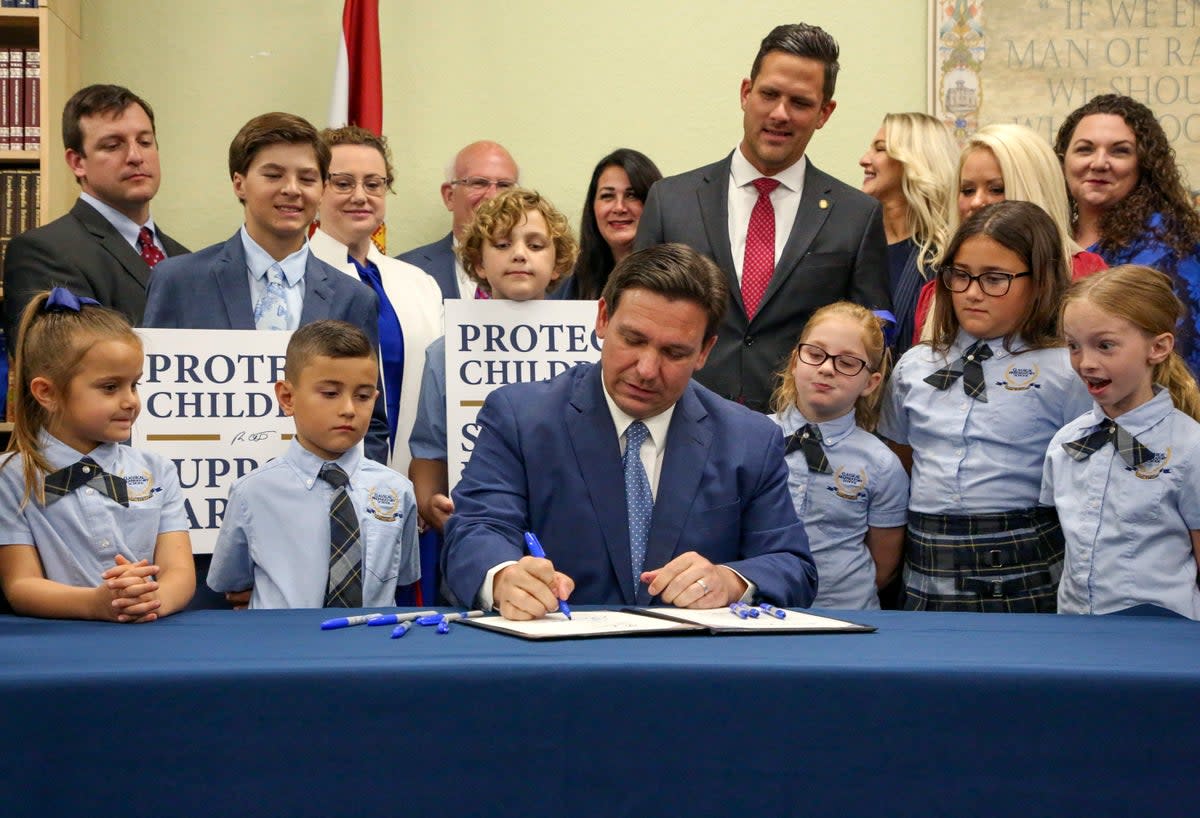 Florida Governor Ron DeSantis is picturing signing what opponents called the ‘Don’t Say Gay’ law on 22 March (AP)