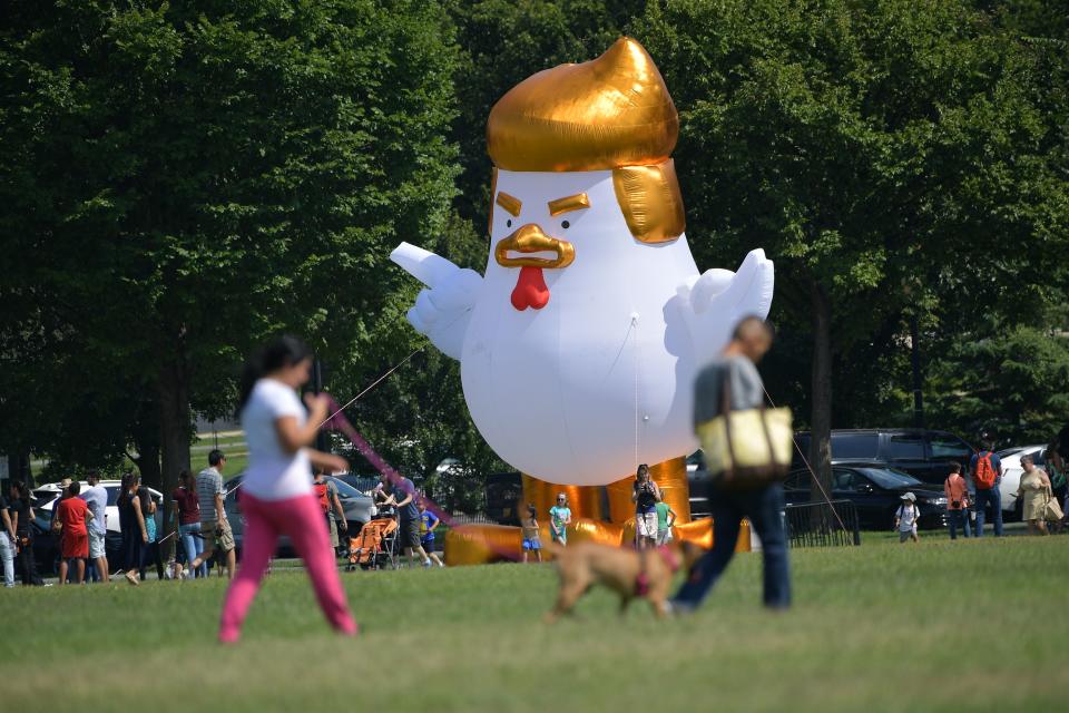 An inflatable chicken mimicking US President Donald Trump is set up on The Ellipse, a 52-acre (21-hectare) park located just south of the White House and north of the Washington Monument. Photographer: MANDEL NGAN/AFP/Getty Images