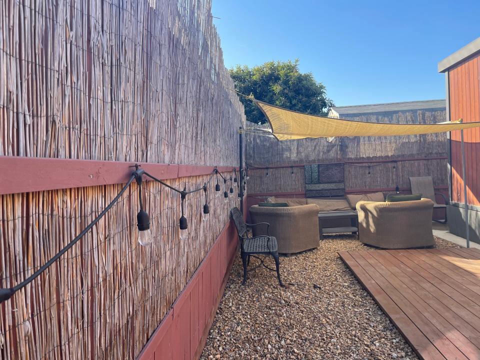 shot of the patio area with string lights outside the tiny home airbnb near disneyland