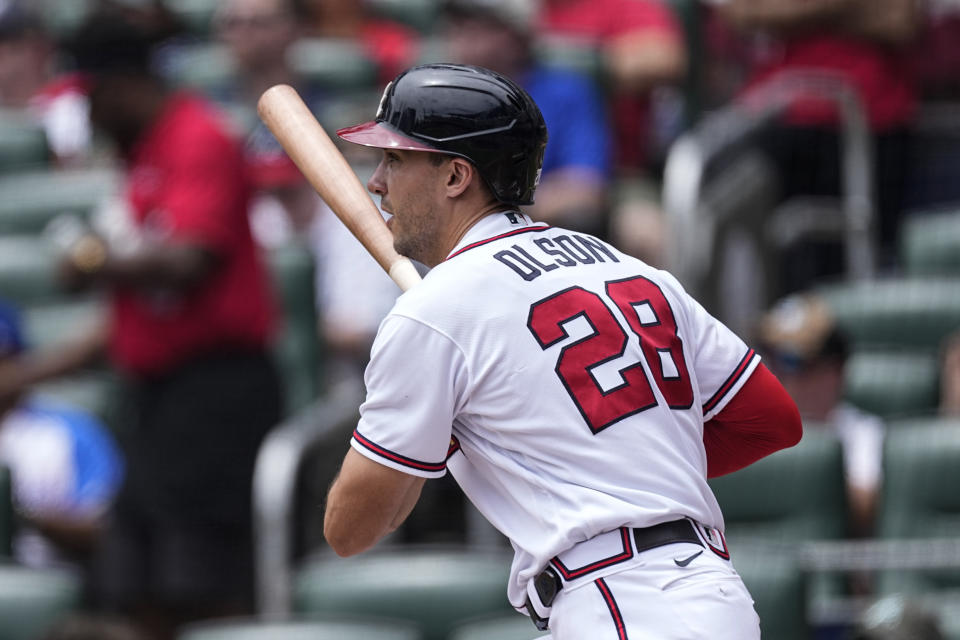 Atlanta Braves' Matt Olson drives in a run with a double during the first inning of a baseball game against the Seattle Mariners, Sunday, May 21, 2023, in Atlanta. (AP Photo/John Bazemore)