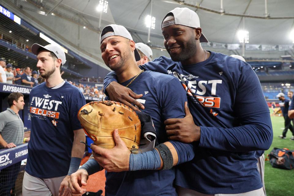 Astros first baseman Yuli Gurriel (left) and left fielder Yordan Alvarez celebrate after Houston clinched the American League West on Sept. 19, 2022 at Tropicana Field.