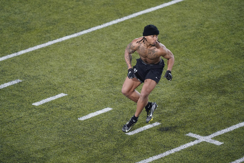 FILE - LSU cornerback Derek Stingley Jr. runs through drills during the school's football pro day in Baton Rouge, La., April 6, 2022. If Stintley cracks the top 10, LSU will join Texas and Ohio State as the only colleges with five top 10 defensive backs in the common draft era. (AP Photo/Gerald Herbert, File)