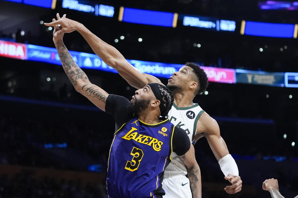 Los Angeles Lakers forward Anthony Davis (3) and Milwaukee Bucks forward Giannis Antetokounmpo watch the ball during the second half of an NBA basketball game Friday, March 8, 2024, in Los Angeles. The Lakers won 123-122. (AP Photo/Jae C. Hong)