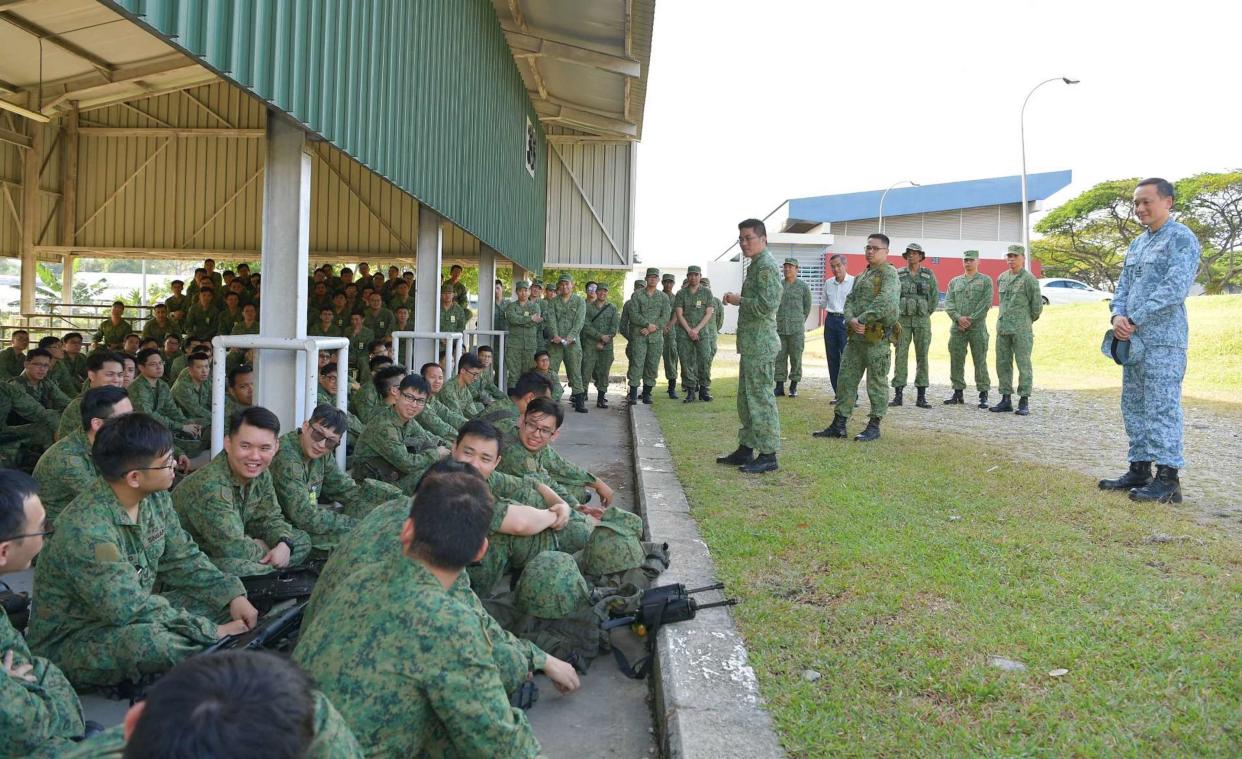 Brigadier General Tan Chee Wee (in blue uniform) speaks to NSmen from the 295th Battalion, Singapore Artillery on 20 February, 2019. (PHOTO: Singapore Armed Forces)