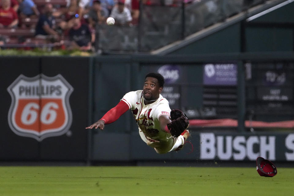 St. Louis Cardinals right fielder Jordan Walker dives and catches a fly ball by Washington Nationals' Riley Adams for an out during the eighth inning in the second game of a baseball doubleheader Saturday, July 15, 2023, in St. Louis. (AP Photo/Jeff Roberson)
