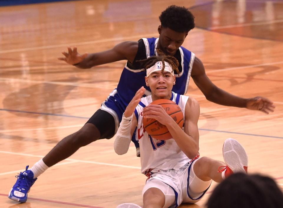 Cooper's Kam Gray calls timeout after battling Lubbock Estacado's Tim Perez for a loose ball. Cooper beat the No. 11 4A Matadors 61-57 in double overtime in a non-district game Tuesday, Nov. 28, 2023, at Cougar Gym.