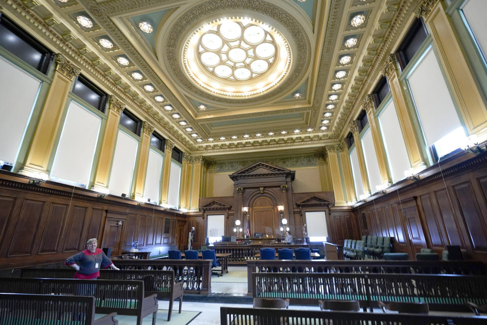 The new windows that were replaced with funding from shale gas fees line the walls of a courtroom at the county courthouse in Washington, Pa., March 28, 2022. A per-well drilling fee on the state’s booming Marcellus Shale gas industry has rained cash on rural counties and municipalities for nearly a decade. Washington County has reaped more than $100 million over the past decade. (AP Photo/Keith Srakocic)