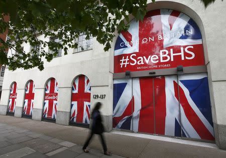 A person walks past the headquarters of retailer British Home Stores after it was announced that BHS is to be wound down after administrators failed to find a buyer for the 88-year-old retailer, in central London, Britain June 2, 2016. REUTERS/Peter Nicholls