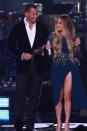 <p>The couple hosted One Voice: Somos Live! A Concert for Disaster Relief in early October, where they appeared onstage together in different shades of navy. A-Rod wore a dark velvet suit jacket, while J.Lo rocked a thigh-high slit dress. (Photo: Getty Images) </p>