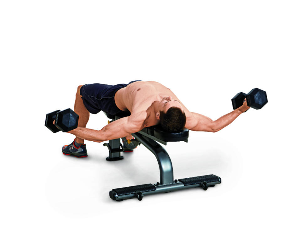 How to do it:<ol><li>Lie back on a flat bench with a dumbbell in each hand.</li><li>Keep a slight bend in your elbows and spread your arms wide, lowering the weights until they’re even with your chest.</li><li>Flex your pecs and lift the weights back to the starting position.</li></ol>