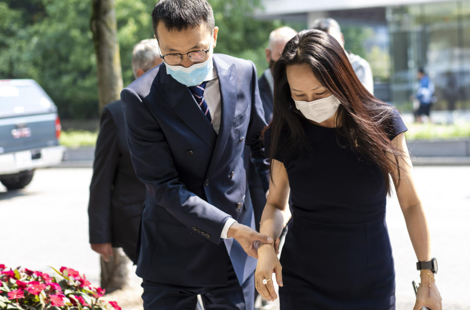 Meng Wanzhou, chief financial officer of Huawei, leaves for a lunch break during her extradition hearing at British Columbia Supreme Court Friday, Aug. 13, 2021 in Vancouver, British Columbia. (Jimmy Jeong/The Canadian Press via AP)