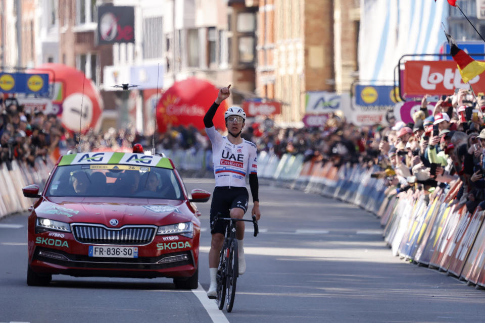 Slovenia's Tadej Pogacar of the UAE Emirates team crosses the finish line to win the Belgian cycling classic and UCI World Tour race Liege Bastogne Liege, in Liege, Belgium, Sunday, April 21, 2024. (AP Photo/Geert Vanden Wijngaert)