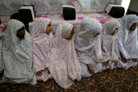 Girls perform dawn prayers at an orphanage in Sanaa, Yemen, December 26, 2016. REUTERS/Khaled Abdullah