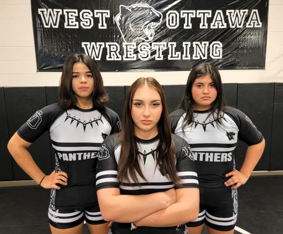 West Ottawa's Le'Anna Zavala, Abrielle VanderZwaag and Isabel Anaya are aiming to qualify for the state wrestling tournament again.