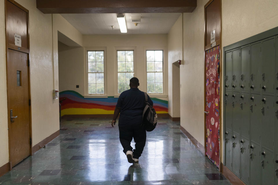 John Simon, a teenager who had a bariatric surgery in 2022, walks along the hallway of his school in Los Angeles, Monday, March 13, 2023. (AP Photo/Jae C. Hong)
