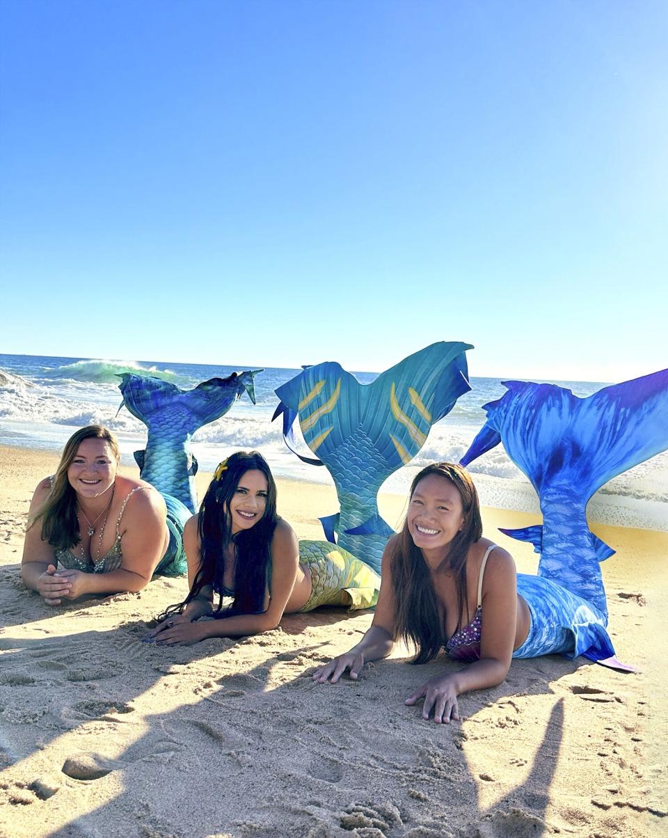 The three mermaids who rescued a man while scuba diving left: Elaina, Elle, then Great Chin