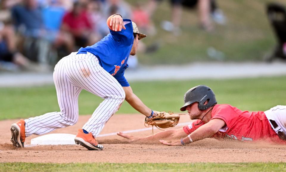 FALMOUTH   07/08/22 Colby Hunter of Falmouth is called out as he slides into the tag of Hyannis third baseman Dominic Pitelli.