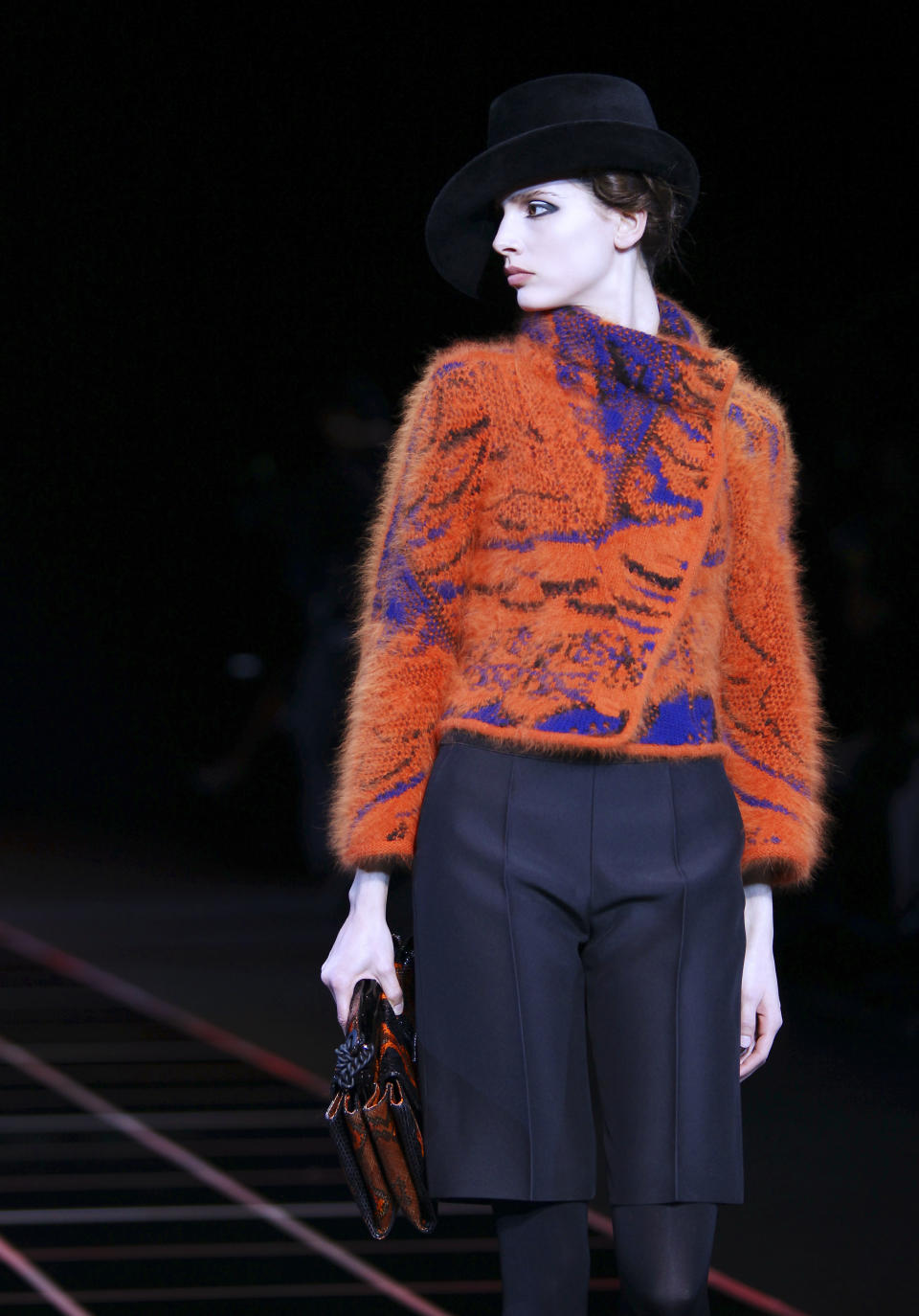 A model wears a creation part of the Giorgio Armani Women's Fall-Winter 2012-13 fashion collection, during the fashion week in Milan, Italy, Monday, Feb. 27, 2012. (AP Photo/Antonio Calanni)