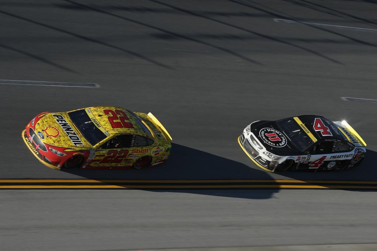 Kevin Harvick trails Joey Logano in this picture, but he leads him in Power Rankings. (Getty)