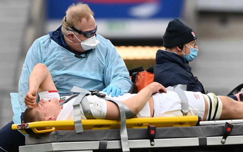 England's Willis is stretchered off with a knee injury against Italy - SHUTTERSTOCK