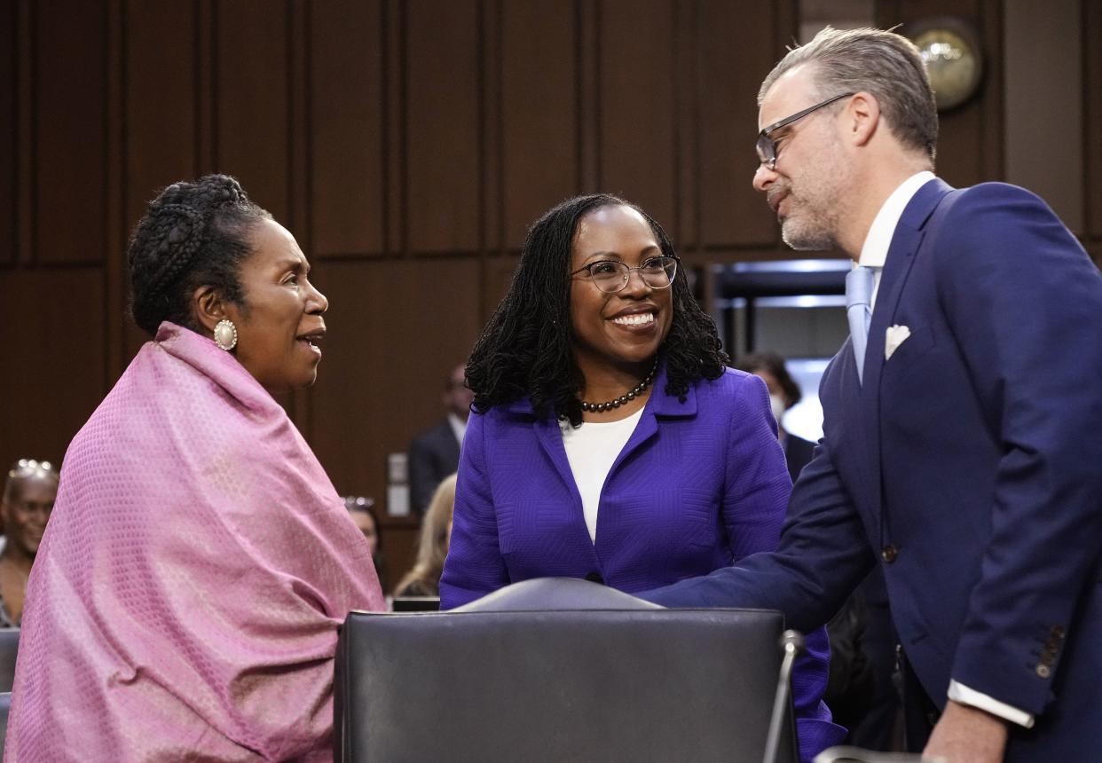 (L-R) Rep. Shelia Jackson Lee (D-TX), U.S. Supreme Court nominee Judge Ketanji Brown Jackson and Patrick Jackson talk during her confirmation hearing before the Senate Judiciary Committee in the Hart Senate Office Building on Capitol Hill on March 21, 2022, in Washington, DC.