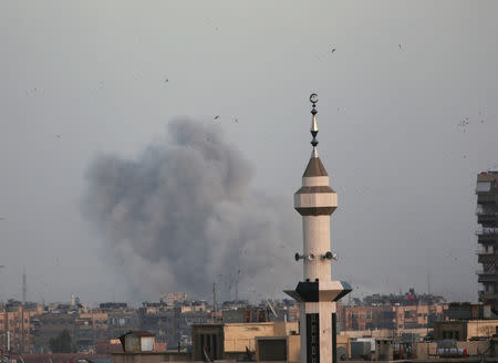 Smoke rises from Yarmouk Palestinian camp in Damascus, Syria April 19, 2018. REUTERS/Ali Hashisho