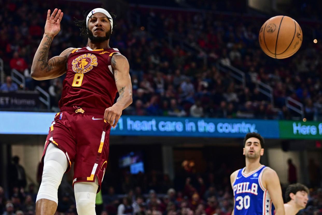 Cleveland Cavaliers forward Lamar Stevens (8) reacts after a dunk in the first half of an NBA basketball game against the Philadelphia 76ers, Sunday, April 3, 2022, in Cleveland. (AP Photo/David Dermer)