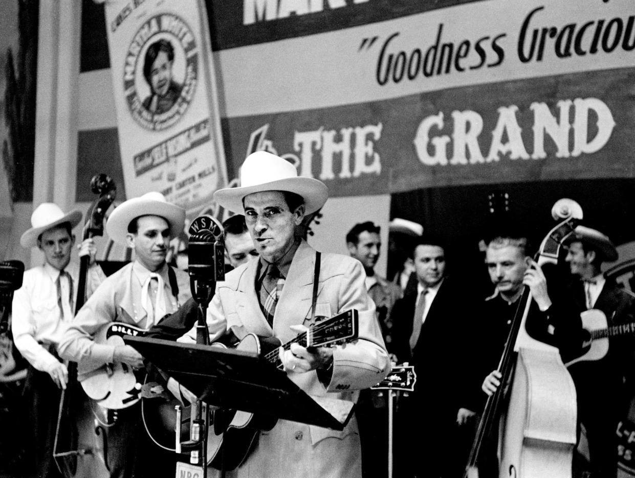 Ernest Tubb, center, plays with his band  Feb. 7, 1953, on the stage of the Ryman Auditorium during the Grand Ole Opry Show. Tubb made famous reader favorite "Waltz Across Texas," written by his nephew Quanah Talmadge Tubb and later covered by Willie Nelson and others.