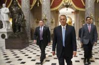 U.S. House Speaker John Boehner (R-OH) (2nd R) returns to his office after a visit to the House floor for procedural votes for legislation to fund the Department of Homeland Security at the Capitol in Washington, February 27, 2015. REUTERS/Jonathan Ernst