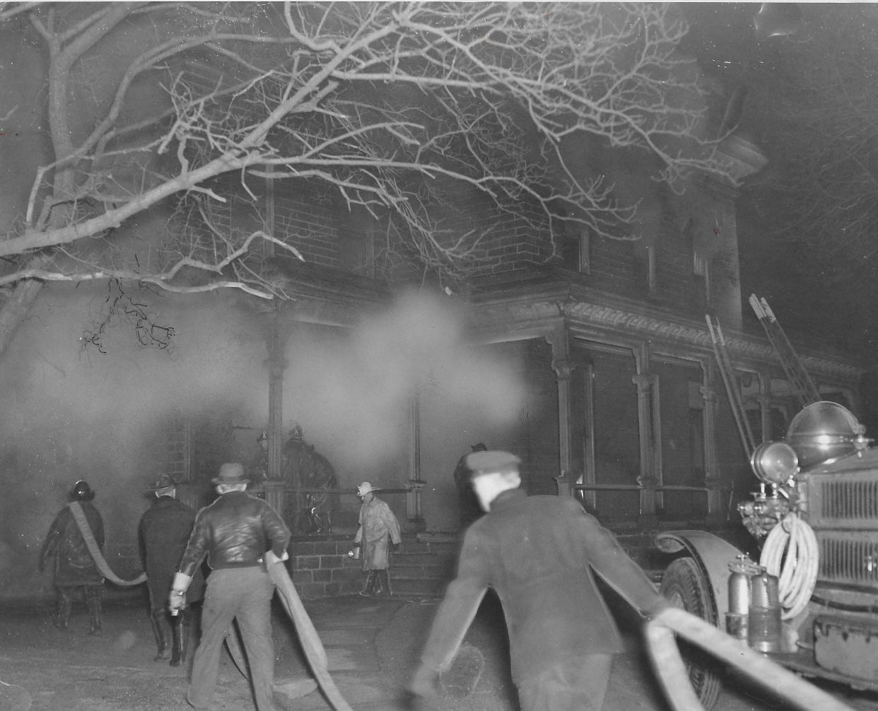 Firefighters battle a blaze in the early hours of Jan. 3, 1942, at the Akron Art Institute at 135 Fir Hill.