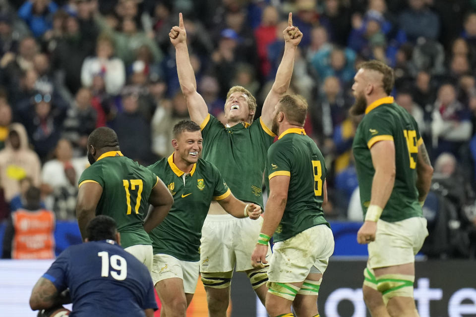 South African players celebrate as they defeat France at the end of the Rugby World Cup quarterfinal match between France and South Africa at the Stade de France in Saint-Denis, near Paris Sunday, Oct. 15, 2023. (AP Photo/Christophe Ena)