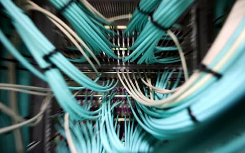 Coaxial cables connect to a computer server unit inside a communications room at an office in London, U.K., on Monday, May 15, 2017.  - Credit:  Chris Ratcliffe/Bloomberg