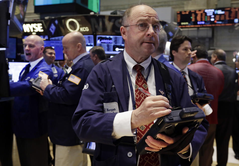 Trader Frederick Reimer, foreground, on the floor of the New York Stock Exchange, Thursday, April 3, 2014. Stocks indexes are edging higher as investors become more optimistic about the outlook for the U.S. economy. (AP Photo/Richard Drew)