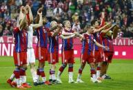 Bayern Munich players acknowledge their fans after winning their German Bundesliga first division soccer match against Hertha Berlin in Munich April 25, 2015 REUTERS/Kai Pfaffenbach