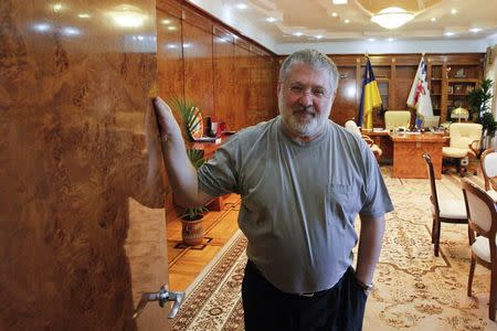 Igor Kolomoisky, billionaire and governor of the Dnipropetrovsk region, poses for a picture at his cabinet in the regional government headquarters in Dnipropetrovsk in this May 24, 2014 file photo. REUTERS/Valentyn Ogirenko/Files