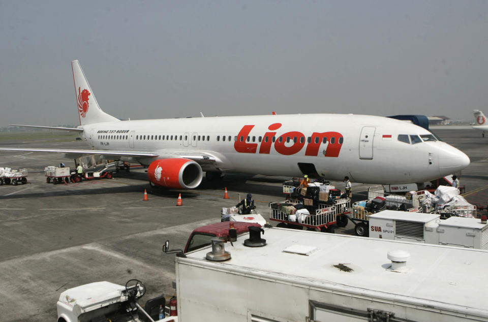 FILE - In this May 12, 2012 file photo, a Lion Air passenger jet is parked on the tarmac at Juanda International Airport in Surabaya, Indonesia. Indonesia's Lion Air said Monday, Oct. 29, 2018, it has lost contact with a passenger jet flying from Jakarta to an island off Sumatra. (AP Photo/Trisnadi, File)